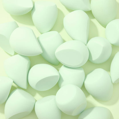 Complexion Blending Sponge set scattered across a pale mint background, mint green teardrop sponges with flat edges and rounded tips, soft foam for seamless foundation blending; ColourPop Makeup Tools & Accessories.