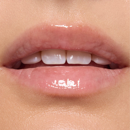 Glossed lips wearing Gumdrop Buttons Candy Lip Oil, showing a sheer high-shine pink tint from ColourPop Candy Lip Oil, captured in a tight on-model close-up under studio lighting.