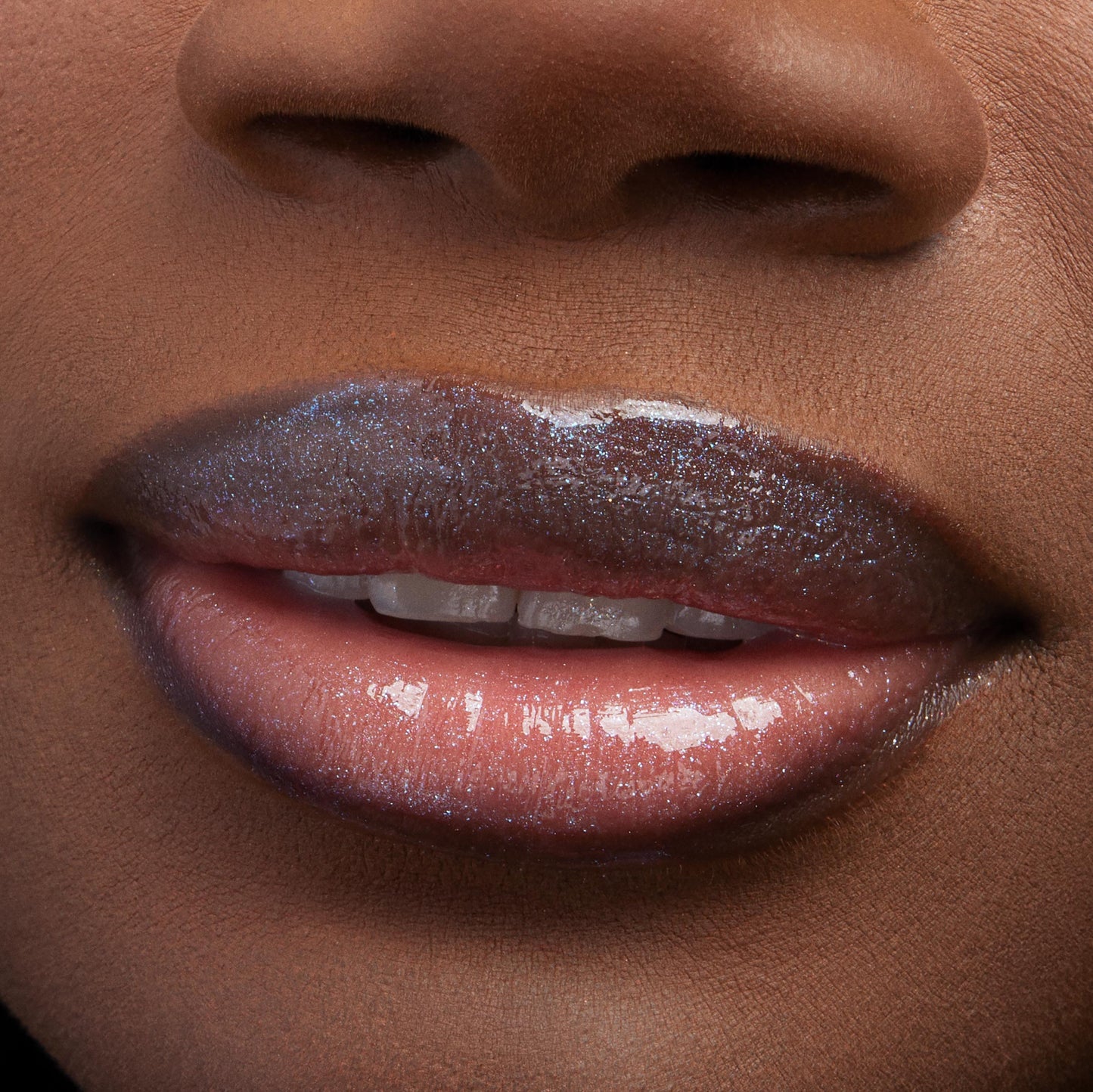 Lips wearing Favorite Deputy Ultra Glossy Lip gleam with a glassy, micro‑shimmer finish, reflecting light in a tight macro close-up that showcases the smooth, hydrated shine of ColourPop Ultra Glossy Lip.